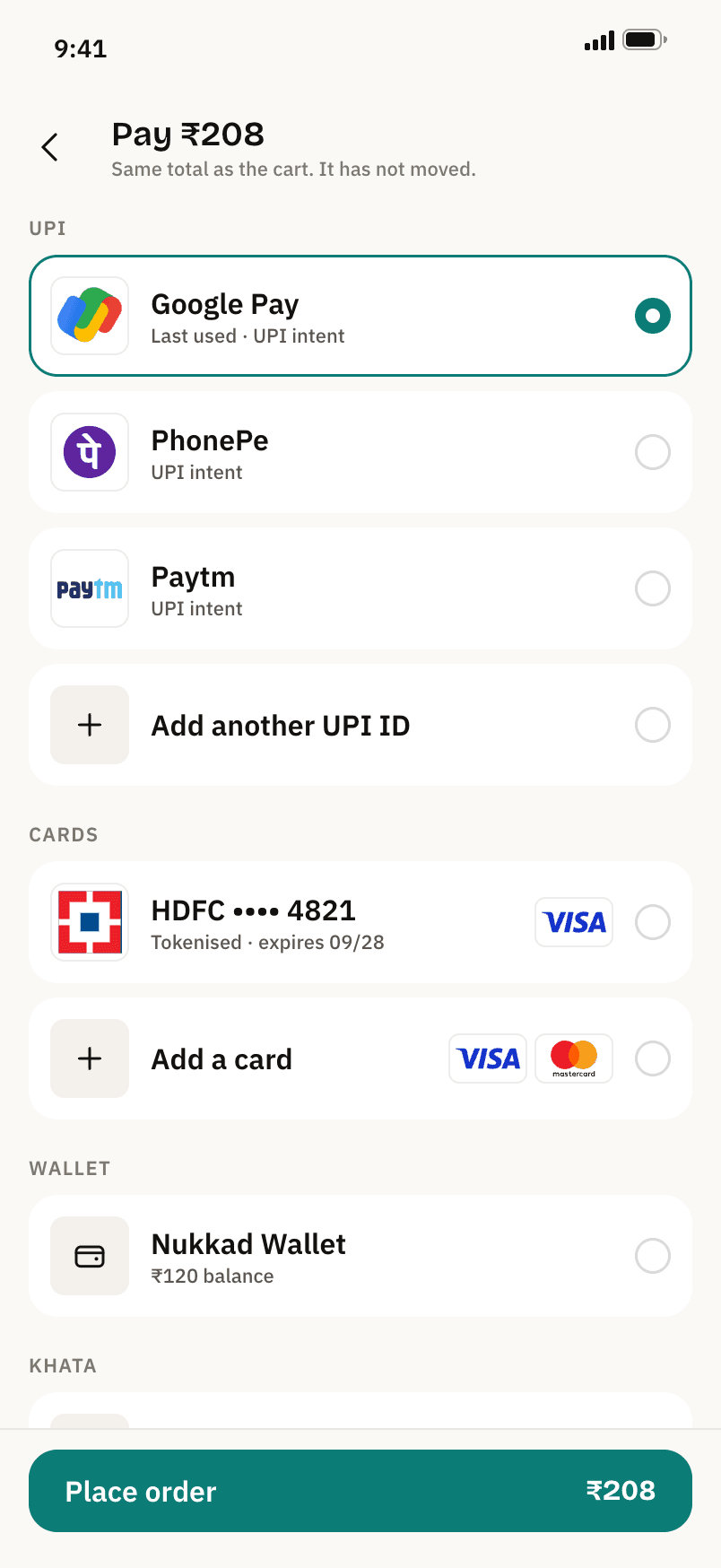 The payment screen: Google Pay selected under UPI, a tokenised HDFC card, the Nukkad wallet, and Place order ₹208